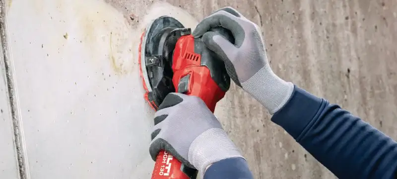 Grinding a concrete wall for a smooth finish, Concrete Grinding Auckland.